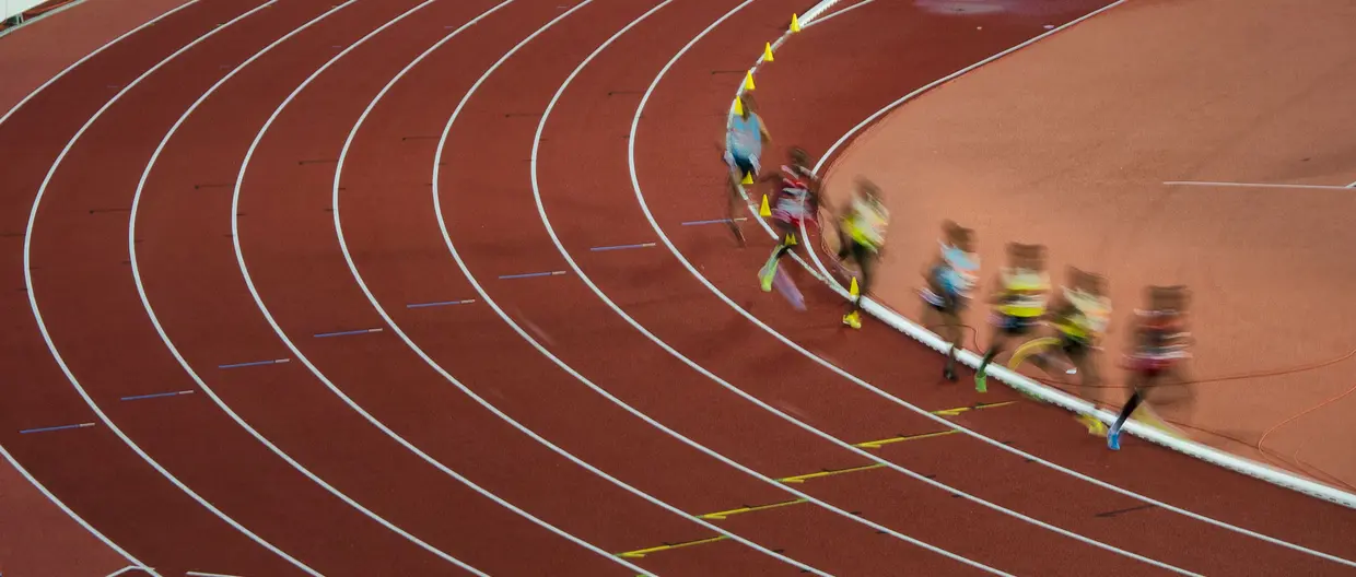 Runners on a curve of the track.