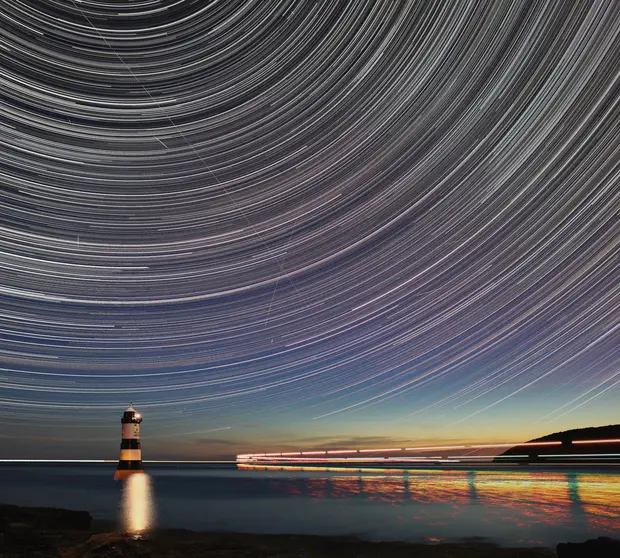 lighthouse at sea at night