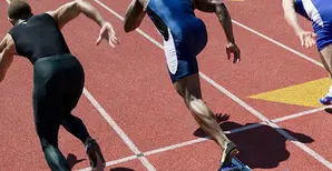 Male runners sprinting on a track