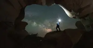 A man walking out of cave