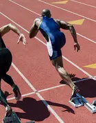Male runners sprinting on a track