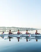 Team of rowers on water