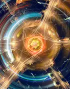 An artistic, abstract depiction of light trails, using long-exposure photography of a city roundabout