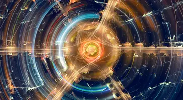 An artistic, abstract depiction of light trails, using long-exposure photography of a city roundabout