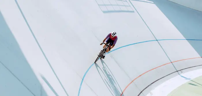 A cyclist on a track field