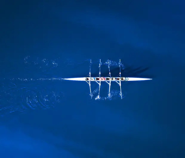 A rowing team viewed from above.