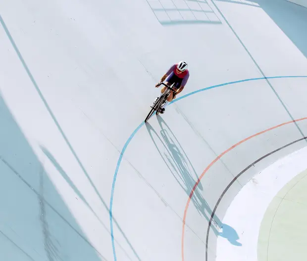 A cyclist on a track field