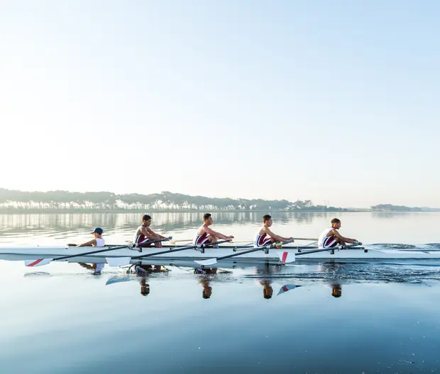 Team of rowers on water