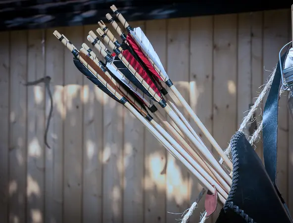 A quiver with arrows hanging from a wall.