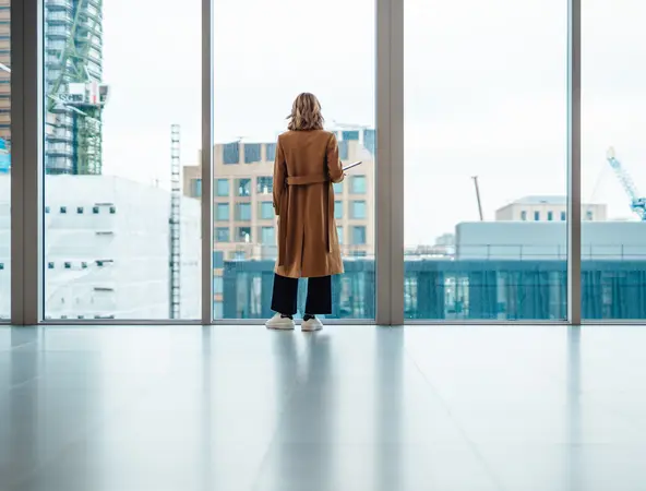 woman watching outside window