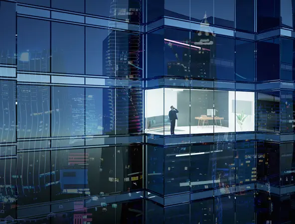 Businessman at a skyscraper building at night