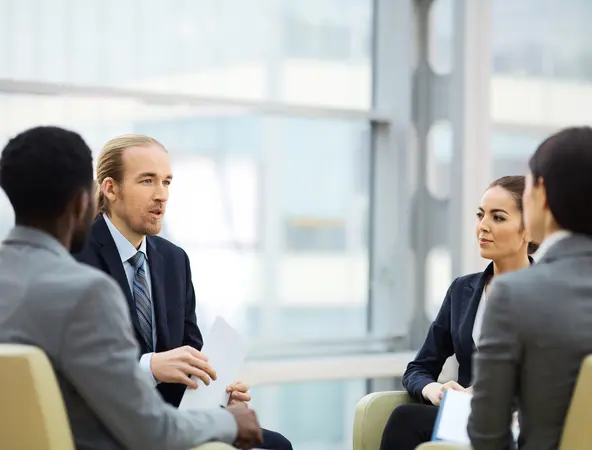 coworkers talking in a meeting 