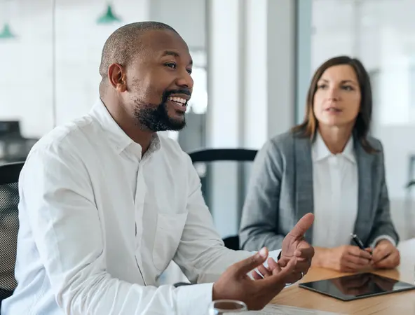 coworkers talking in a meeting 