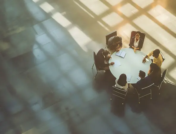 Aerial view of diverse business people talking around a table