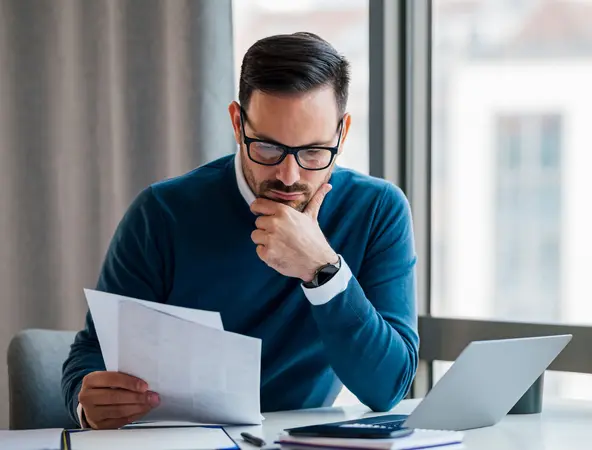 Financial specialist reading the shareholder notice