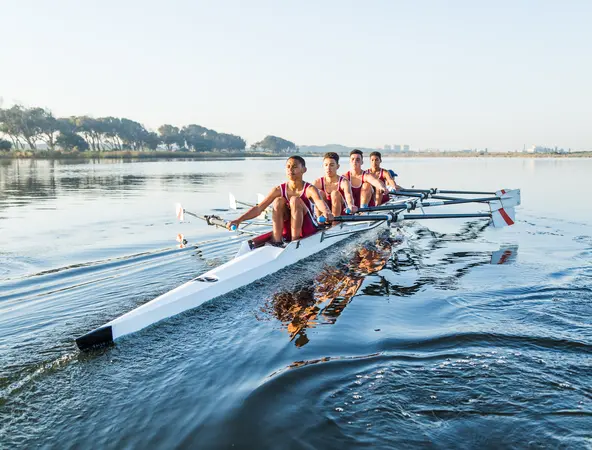 Team of rowers on water frontfacing