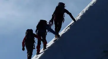 ARA - Private Equity - three-men-climbing-a-snow-covered-mountain