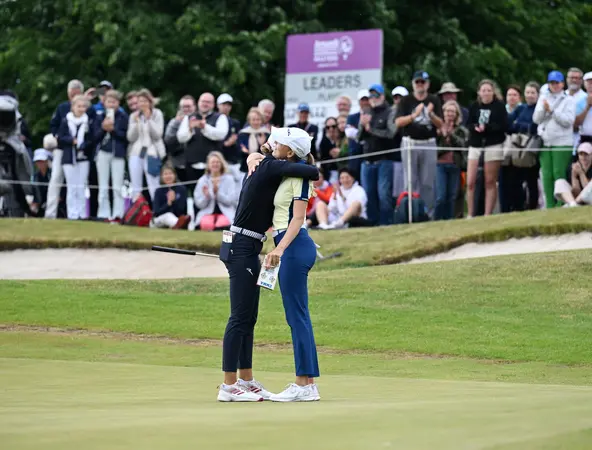 Golf players hug