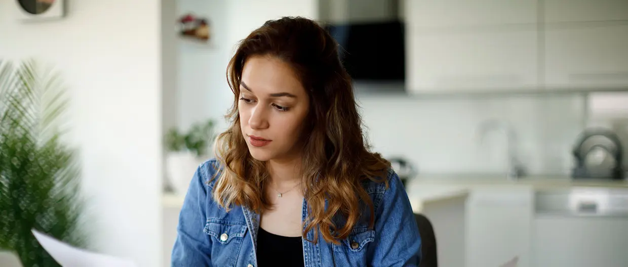 a girl reading documents at home