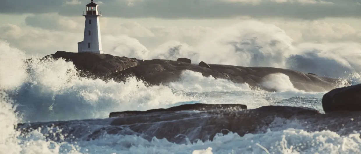 Lighthouse surrounded by surf