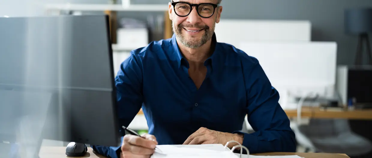 man at his desk working