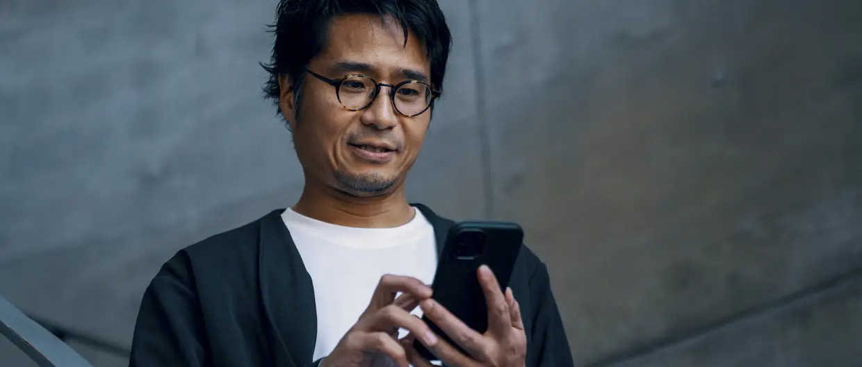 man looking at his phone