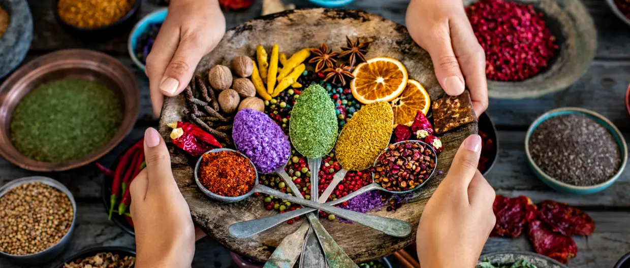 Various spices and dried fruits on the table.