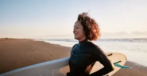 surfer girl on a beach
