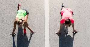 sportswomen preparing to run