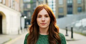 Woman with red hair on street
