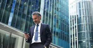 Man checking his phone in a financial district