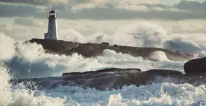 Lighthouse surrounded by surf