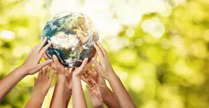 people's hands holding up the  globe