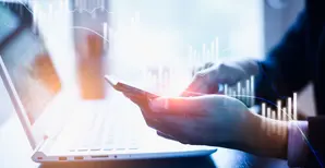 businessman touching a smartphone with stock graph on it