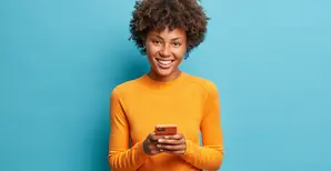 woman with mustard jumper smiling 