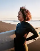 surfer girl on a beach