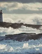 Lighthouse surrounded by surf