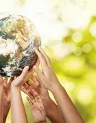 people's hands holding up the  globe