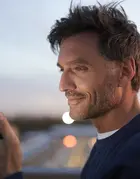 Man 40s looking at his phone