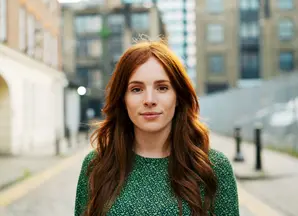 Woman with red hair on street