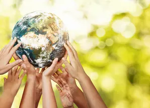 people's hands holding up the  globe