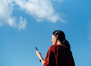 Women blue sky phone