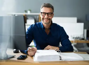 man at his desk working