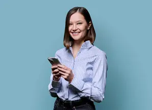 woman with a shirt looking at her phone