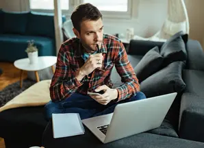 man thinking at his desk