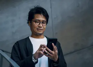 man looking at his phone