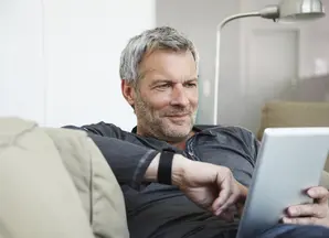 Portrait of man sitting on couch 