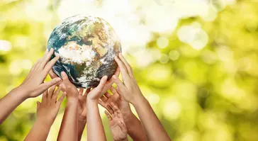 people&#039;s hands holding up the  globe