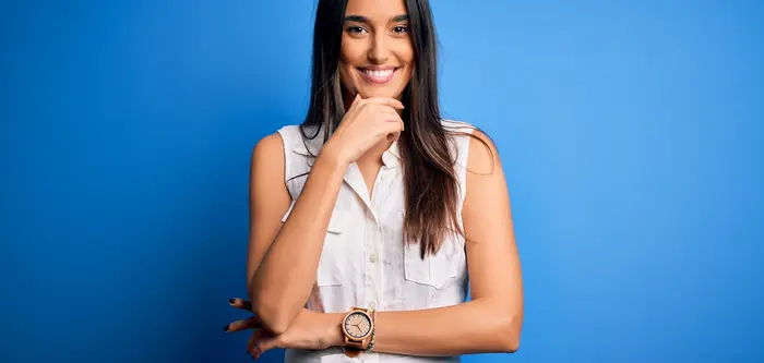 woman smiling, blue background