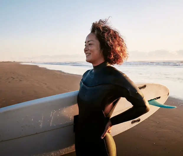 surfer girl on a beach